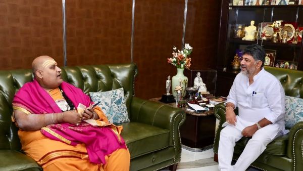 Renowned Astrologer Brahmanda Guruji Meets DK Shivakumar Sparks Political Speculation