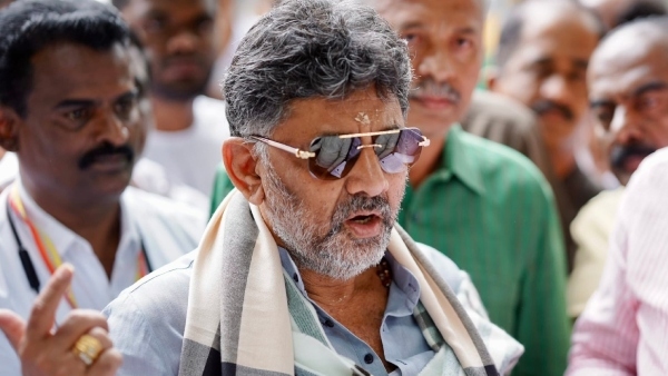 D K Shivakumar Sparks Outrage After Publicly Assaulting RCB Fan on Stage Video Viral