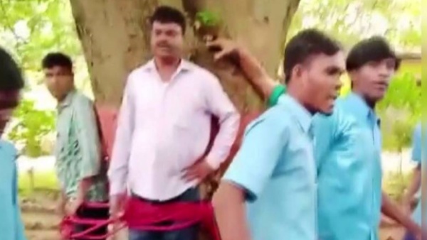 കണക്ക് പരീക്ഷയ്ക്ക് മാർക്ക് കുറച്ചു, അധ്യാപകനെ മരത്തില്‍ കെട്ടിയിട്ട് തല്ലി വിദ്യാർഥികൾ