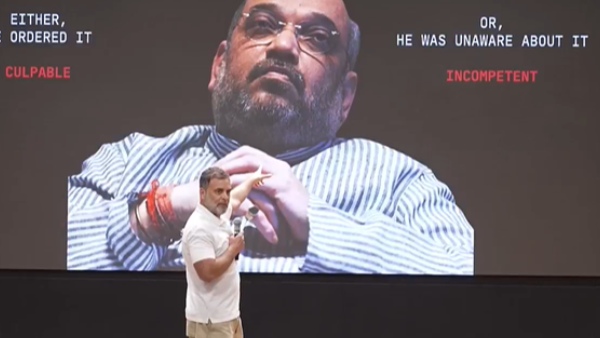 rahul gandhi demand amit shah resign