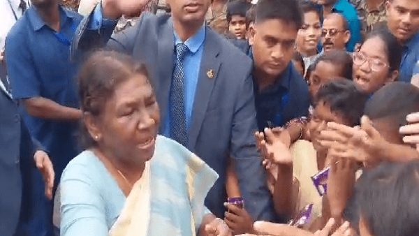 president distributes chocolate