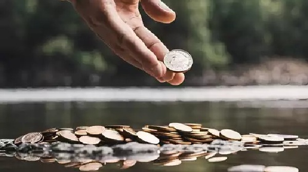 What is the reason people throw coins into the river
