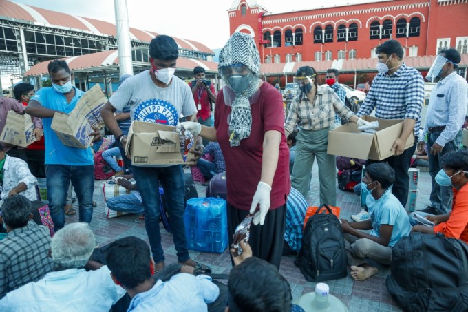 Migrants wait to board a Shramik train at Chennai Central Railway Station