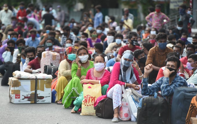 Migrants wait to board a Shramik train at Chennai Central Railway Station