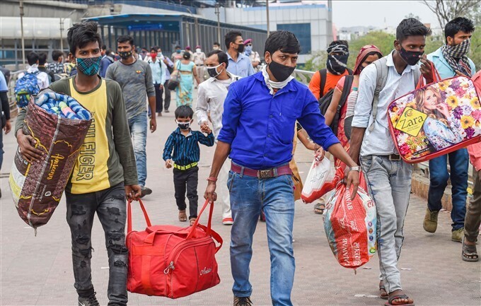 കൊവിഡ് രൂക്ഷം, പലായനം തുടങ്ങി കുടിയേറ്റ തൊഴിലാളികൾ,  ചിത്രങ്ങൾ കാണാം