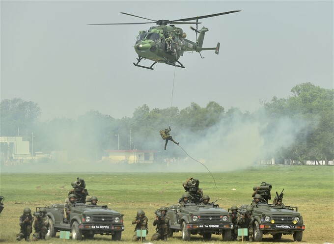 Para Brigade personnel perform during combat free fall by 75 paratroopers at BOC Ground in Agra