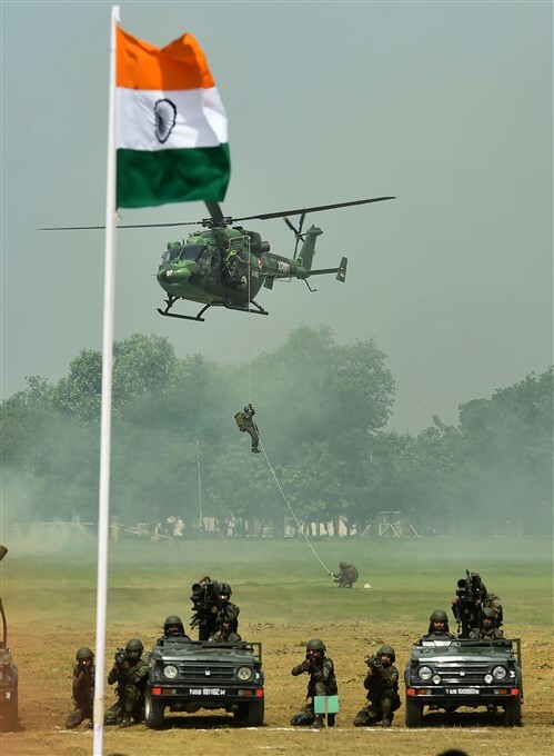 Para Brigade personnel perform during combat free fall by 75 paratroopers at BOC Ground in Agra