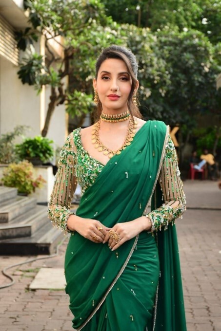 Bollywood Actress Nora Fatehi Looks Stunning In Green Saree
