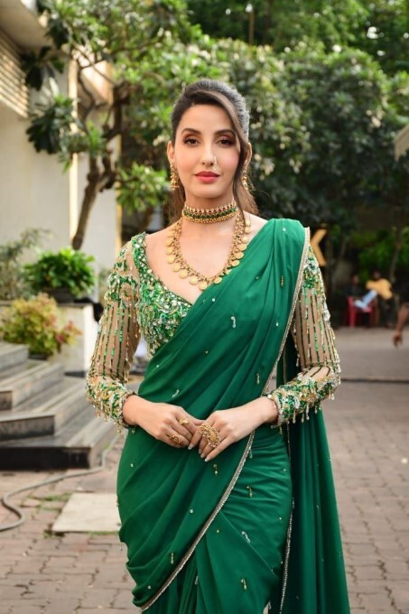 Bollywood Actress Nora Fatehi Looks Stunning In Green Saree