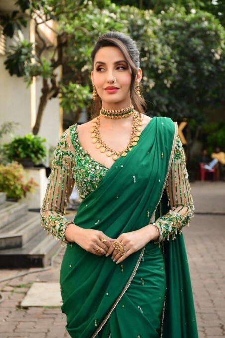 Bollywood Actress Nora Fatehi Looks Stunning In Green Saree