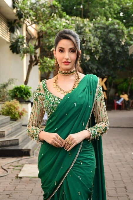 Bollywood Actress Nora Fatehi Looks Stunning In Green Saree