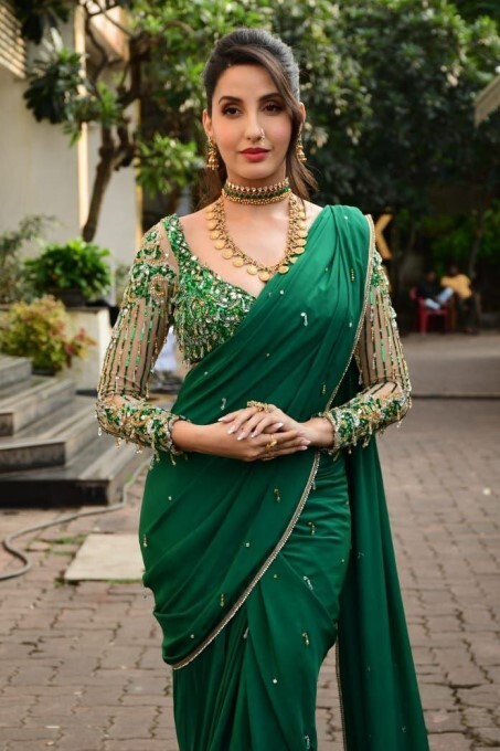 Bollywood Actress Nora Fatehi Looks Stunning In Green Saree