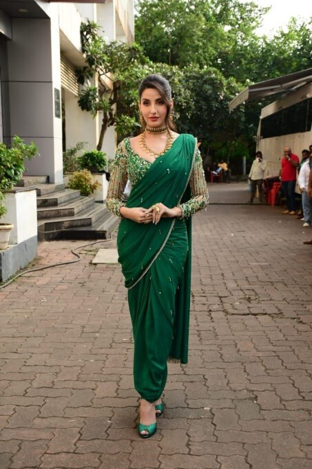 Bollywood Actress Nora Fatehi Looks Stunning In Green Saree