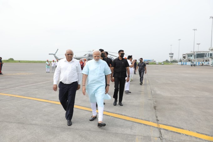 PM Modi received by CM Bhupendra Patel in Surat, Gujarat - Oneindia