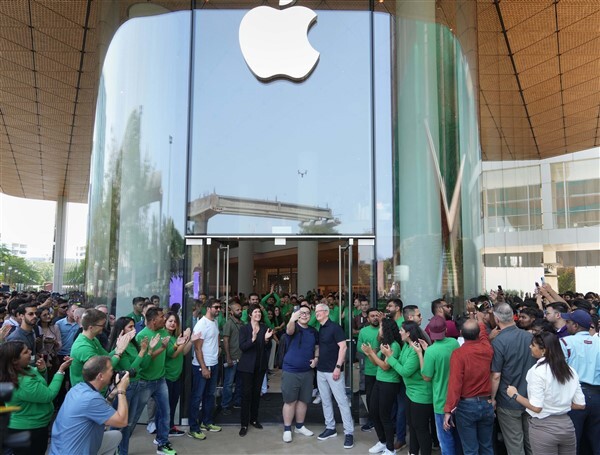 People visit India's first Apple retail store after its opening, at BKC in Mumbai