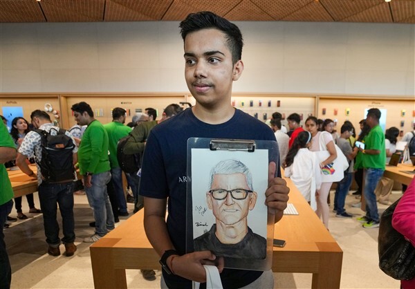 People visit India's first Apple retail store after its opening, at BKC in Mumbai