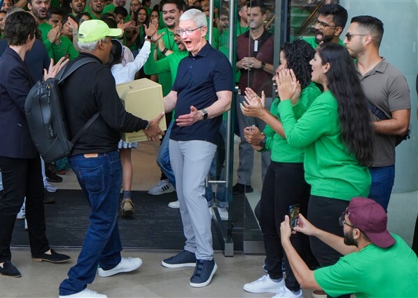 People visit India's first Apple retail store after its opening, at BKC in Mumbai