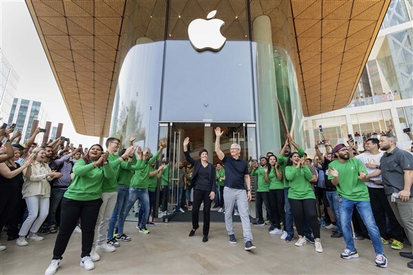 People visit India's first Apple retail store after its opening, at BKC in Mumbai