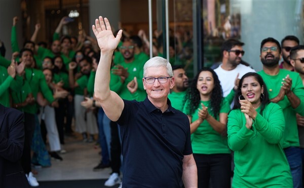 People visit India's first Apple retail store after its opening, at BKC in Mumbai