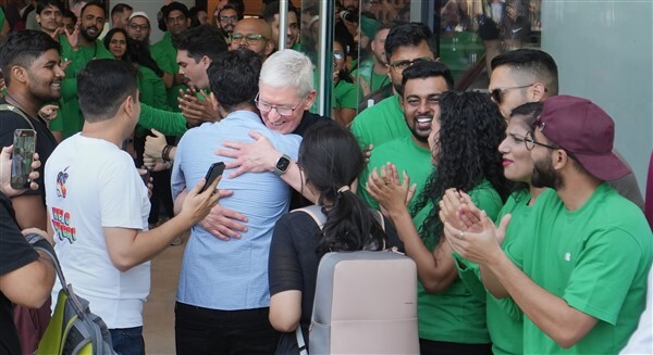 People visit India's first Apple retail store after its opening, at BKC in Mumbai