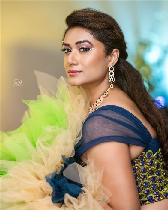 Actress Tanisha Kuppanda looks bold and beautiful in peacock outfit new photos