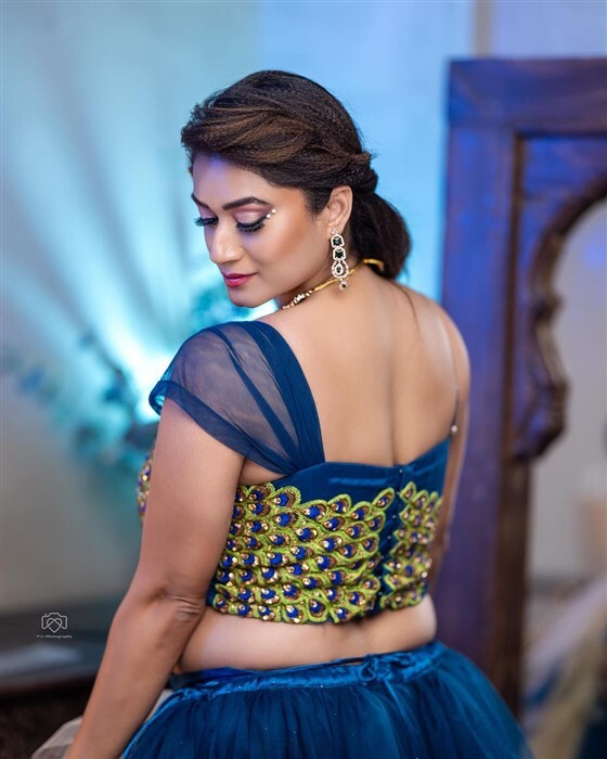 Actress Tanisha Kuppanda looks bold and beautiful in peacock outfit new photos