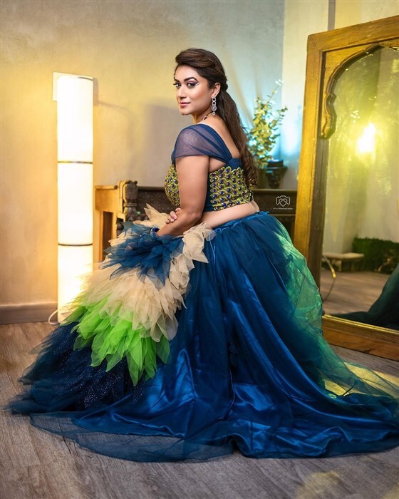 Actress Tanisha Kuppanda looks bold and beautiful in peacock outfit new photos