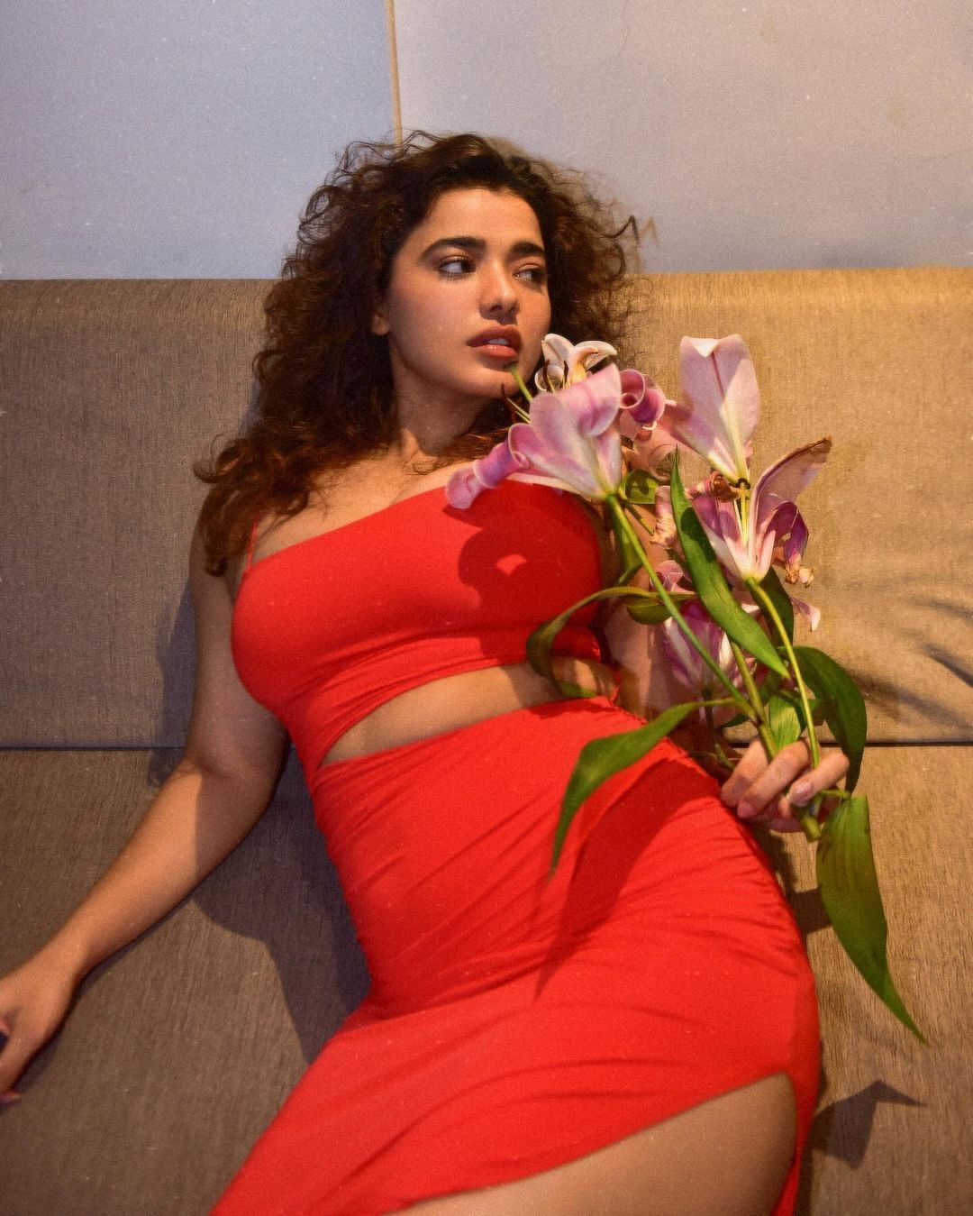 Ketika Sharma ignites passion in a ravishing red dress, setting hearts ablaze with her allure.
