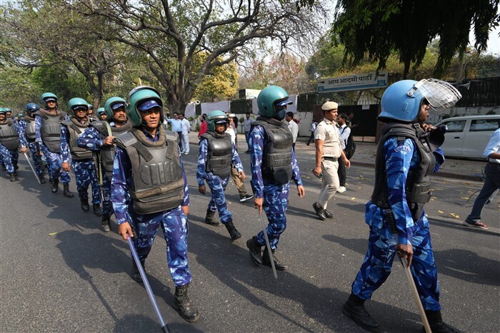 Security personnel keep a vigil outside the AAP's office, in New Delhi