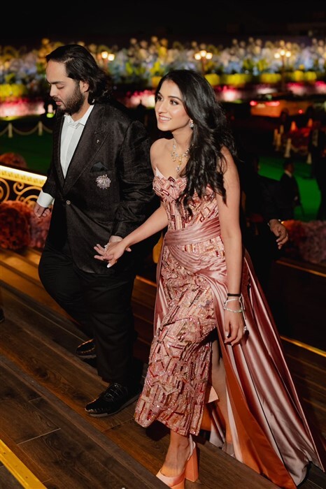 Anant Ambani and Radhika Merchant make a grand entrance at the pre-wedding bash.