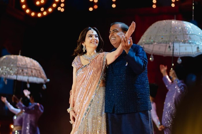 Mukesh and Nita Ambani perform at the pre-wedding bash.
