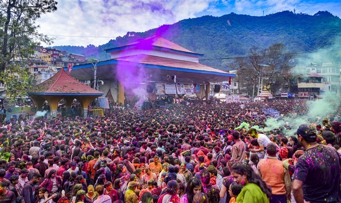 People celebrate Holi, in Mandi