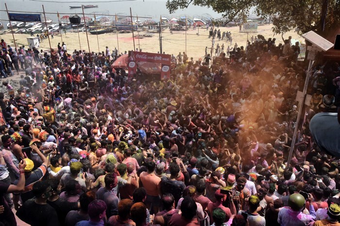 People play with colours on the occasion of Holi festival