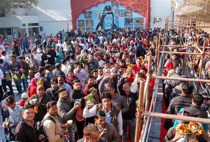 Devotees wait to offer prayers at a Shiv temple