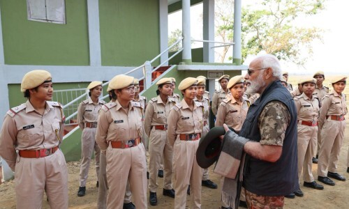 Prime Minister Narendra Modi engages in conversation with female police personnel during his tour of