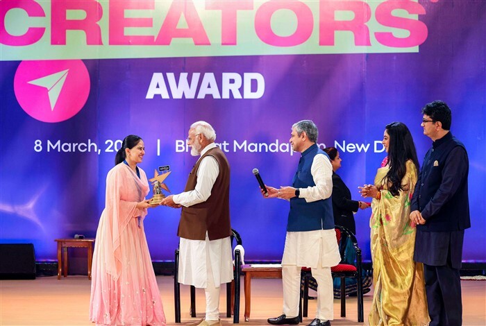 Prime Minister Narendra Modi awards Katha-wachak Jaya Kishori at the National Creators Awards 2024