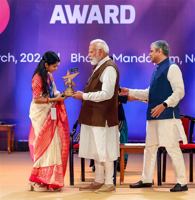 Prime Minister Narendra Modi presents Cultural Ambassador of the year award to singer Maithili Thaku