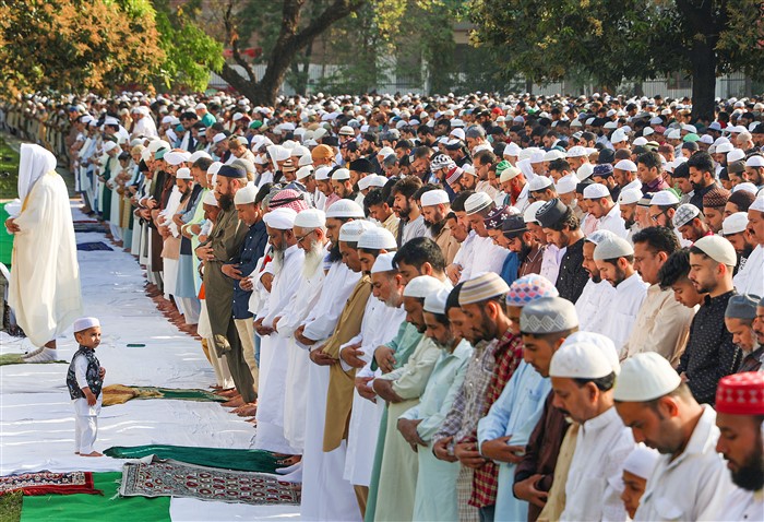 Muslim devotees offer prayers on the occassion of Eid al-Fitr, at Eid Gah in Jammu