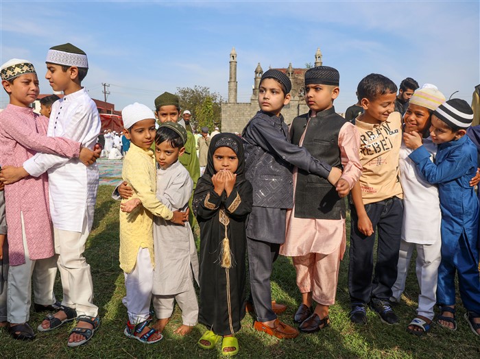 Muslim children celebrate Eid-al-Fitr, at an Eidgah, in Jammu