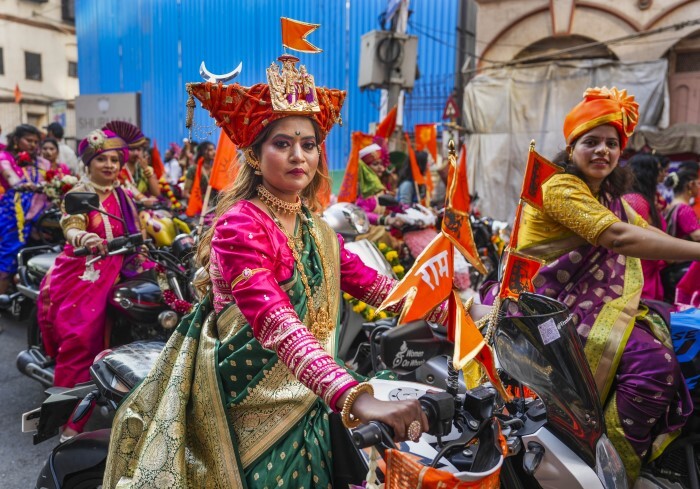 Women dressed in traditional attire participate in a rally on the occasion of 'Gudi Padwa'