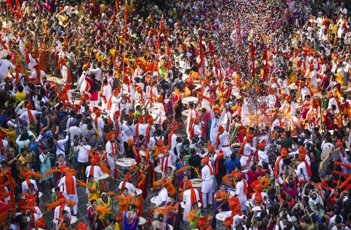 People dressed in traditional attire participate in a rally on the occasion of 'Gudi Padwa'