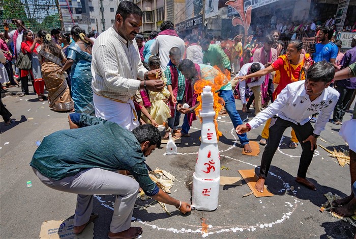 Devotees burn camphor as part of a ritual during the celebration of 'Karaga' festival