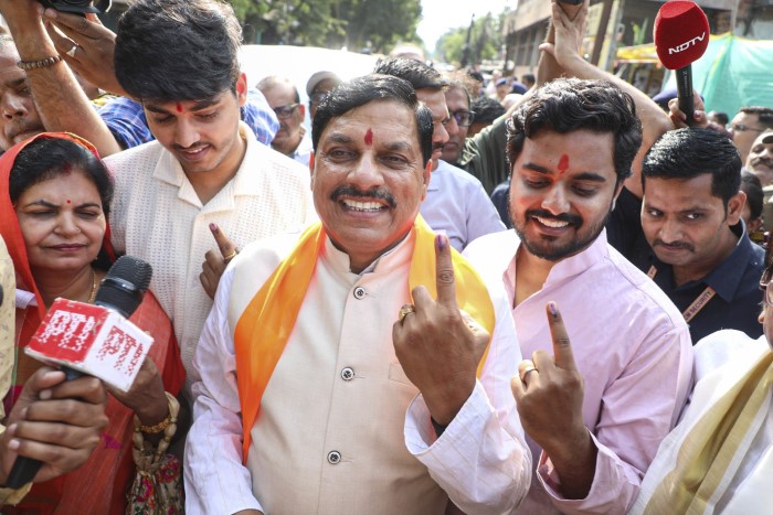 Ujjain: Madhya Pradesh Chief Minister Mohan Yadav with family members shows his inked finger