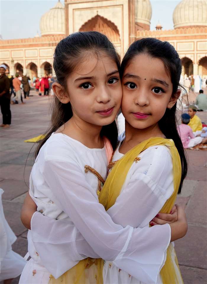 Muslims greet each other after offering prayers on Eid al-Adha festival at the Kharudin Jama Masjid, in Amritsar.