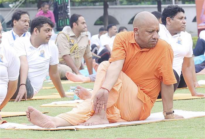 Uttar Pradesh Chief Minister Yogi Adityanath performs yoga at the Raj Bhavan