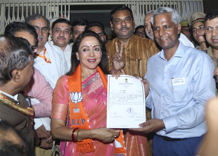BJP leader and candidate from Mathura constituency Hema Malini receives certificate after winning the Lok Sabha elections, in Mathura.