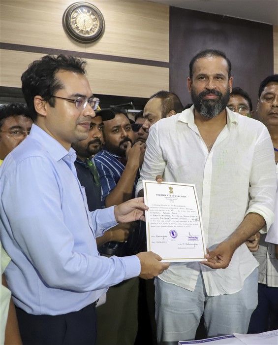 Former cricketer and TMC candidate from Baharampur constituency Yusuf Pathan receives certificate after winning the Lok Sabha elections, in Murshidabad district.