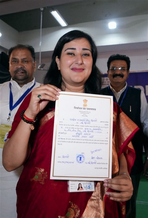 BJP candidate from New Delhi constituency Bansuri Swaraj shows certificate after winning the Lok Sabha elections, in New Delhi.