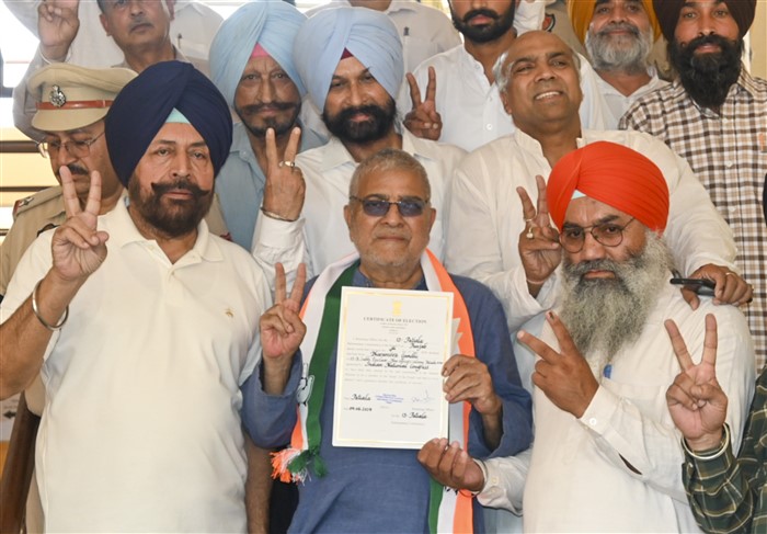 Congress candidate from Patiala constituency Dharamvira Gandhi receives certificate at a counting center after winning the Lok Sabha elections, in Patiala