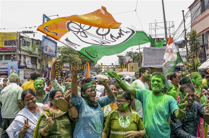 TMC supporters celebrate the party's lead during counting of votes for Lok Sabha elections, outside party supremo Mamata Banerjee's Kalighat residence, in Kolkata.